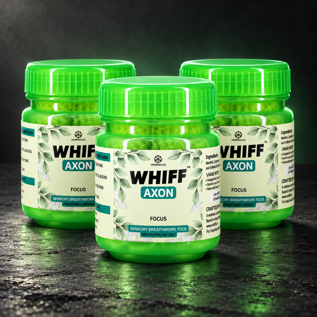 Three WHIFF AXON jars on a dark charcoal studio background